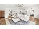 Open-concept living room with bar stool seating and hardwood floors at 5028 Graceland Ave, Indianapolis, IN 46208