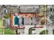 Aerial view of backyard oasis with a pool, patio, and lush landscaping at 5116 Norway Dr, Indianapolis, IN 46219