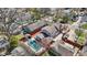 Aerial view of fenced backyard featuring swimming pool and mature trees at 5116 Norway Dr, Indianapolis, IN 46219
