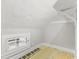 Finished attic space with painted floor and natural light from window at 5116 Norway Dr, Indianapolis, IN 46219