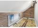 Unique attic space with wood plank walls and custom floor design at 5116 Norway Dr, Indianapolis, IN 46219