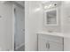 Bright bathroom featuring a shower with glass doors and a vanity with a mirror and lighting at 5116 Norway Dr, Indianapolis, IN 46219