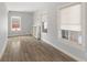Bedroom with three windows, hardwood floors, and lots of natural light at 5116 Norway Dr, Indianapolis, IN 46219