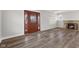Inviting entryway showcases a beautiful wood door and fresh paint, complemented by modern wood-look flooring at 5116 Norway Dr, Indianapolis, IN 46219