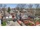 Charming home showcasing a spacious driveway and fenced backyard at 5116 Norway Dr, Indianapolis, IN 46219