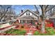 Charming two-story home with inviting brick porch and landscaped front yard at 5116 Norway Dr, Indianapolis, IN 46219