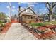 Charming two-story home with a manicured lawn and established landscaping at 5116 Norway Dr, Indianapolis, IN 46219
