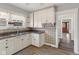 Traditional kitchen with tile countertops, double sink and wood-style flooring at 5116 Norway Dr, Indianapolis, IN 46219
