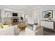 Bright living room with fireplace, modern decor, and hardwood floors at 5116 Norway Dr, Indianapolis, IN 46219
