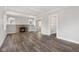 Bright living room with fireplace, wood floors, and fresh paint at 5116 Norway Dr, Indianapolis, IN 46219