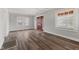 Bright living room featuring wood floors, large windows, and fresh paint, creating a welcoming atmosphere at 5116 Norway Dr, Indianapolis, IN 46219
