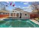Backyard pool with covered gazebo and a sunroom-style extension at 5116 Norway Dr, Indianapolis, IN 46219