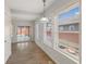 Bright sunroom with lots of windows and wood floors next to covered outdoor patio at 5116 Norway Dr, Indianapolis, IN 46219