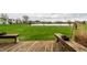 Enjoy backyard views from the deck with green grass leading to a lake view and seating at 5367 Cotton Bay W Dr, Indianapolis, IN 46254