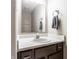 Bathroom vanity with a stylish sink, faucet, and mirror, complete with a towel ring and storage cabinets at 5367 Cotton Bay W Dr, Indianapolis, IN 46254