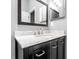 Bathroom featuring a dark wood vanity with a marble countertop and framed mirror at 5367 Cotton Bay W Dr, Indianapolis, IN 46254