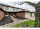 Charming townhome with brick accents, featuring a welcoming entrance and attached garage at 5367 Cotton Bay W Dr, Indianapolis, IN 46254