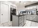 Functional kitchen with stainless steel fridge and kitchen island at 5367 Cotton Bay W Dr, Indianapolis, IN 46254