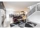 Bright living area featuring a fireplace, sofa, and open access to other living spaces at 5367 Cotton Bay W Dr, Indianapolis, IN 46254