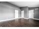 Spacious living room with a gray color palette, providing a blank slate for your personal touch at 5367 Cotton Bay W Dr, Indianapolis, IN 46254