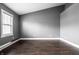 Inviting living room showcasing hardwood floors, fresh paint, and lots of natural light at 5367 Cotton Bay W Dr, Indianapolis, IN 46254