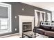 Living room with a fireplace, modern décor, and neutral color palette at 5367 Cotton Bay W Dr, Indianapolis, IN 46254