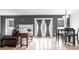 Open-concept living room with a fireplace, dining area, and sliding glass doors to bring the outdoors in at 5367 Cotton Bay W Dr, Indianapolis, IN 46254