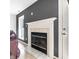 Inviting living room with a classic fireplace and light-filled window at 5367 Cotton Bay W Dr, Indianapolis, IN 46254