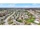 Scenic aerial neighborhood view highlighting a community with homes, trees, and a pond at 5426 Black Bear Cir, Indianapolis, IN 46239