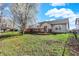 Expansive backyard featuring a green lawn, patio, and mature trees, creating a peaceful retreat at 5426 Black Bear Cir, Indianapolis, IN 46239