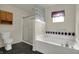 Well-lit bathroom featuring soaking tub, glass-enclosed shower, and toilet at 5426 Black Bear Cir, Indianapolis, IN 46239