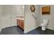A half-bathroom offering a toilet, sink, vanity, and storage space for all your essentials at 5426 Black Bear Cir, Indianapolis, IN 46239