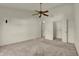 A clean bedroom offers lots of open space, neutral carpeting, an open closet and en-suite at 5426 Black Bear Cir, Indianapolis, IN 46239
