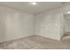 This neutral carpeted bedroom features fresh paint and a door leading to other rooms at 5426 Black Bear Cir, Indianapolis, IN 46239