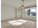 Dining room with a traditional chandelier, window, and neutral carpet at 5426 Black Bear Cir, Indianapolis, IN 46239