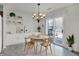 Cozy dining area with stylish light fixture and built-in shelving, bathed in natural light at 5426 Black Bear Cir, Indianapolis, IN 46239
