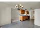 Transitional eat-in kitchen featuring wooden cabinetry and modern lighting at 5426 Black Bear Cir, Indianapolis, IN 46239