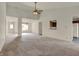 Open-concept living room with carpeted floors, connecting to other rooms in the home at 5426 Black Bear Cir, Indianapolis, IN 46239