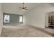 Spacious carpeted main bedroom features high vaulted ceiling with fan and bright light from two large windows at 5426 Black Bear Cir, Indianapolis, IN 46239