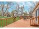Inviting backyard with a wooden deck and green lawn, plus a storage shed, great for entertaining at 5734 Hillside Ave, Indianapolis, IN 46220