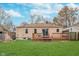 Cozy backyard with a wooden deck and a well-maintained lawn, perfect for outdoor enjoyment at 5734 Hillside Ave, Indianapolis, IN 46220