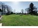 A large backyard featuring a storage shed, providing ample space for outdoor activities and landscaping opportunities at 6047 W 56Th St, Indianapolis, IN 46254