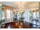 Dining room featuring mirrored walls, hardwood flooring and a decorative chandelier at 6047 W 56Th St, Indianapolis, IN 46254