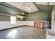 Spacious garage featuring durable tile flooring, painted walls, utility sink, and ample storage space at 6047 W 56Th St, Indianapolis, IN 46254