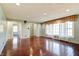 Open living room with hardwood floors, recessed lighting and large window with view at 6047 W 56Th St, Indianapolis, IN 46254
