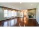 Bright living room with stone fireplace, hardwood floors and large window with valance at 6047 W 56Th St, Indianapolis, IN 46254