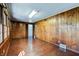 Charming room with hardwood floors, wood paneling, with large windows offering ample sunlight at 6047 W 56Th St, Indianapolis, IN 46254