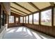 Inviting sunroom with durable tiled flooring, expansive windows, and natural light at 6047 W 56Th St, Indianapolis, IN 46254