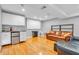 Basement area with a kitchenette featuring cabinets and beverage fridge, plus comfortable leather seating at 6071 Sugar Pine Dr, Avon, IN 46123