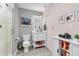 Well-lit bathroom featuring a vanity with storage, a toilet, and a tiled shower at 6071 Sugar Pine Dr, Avon, IN 46123